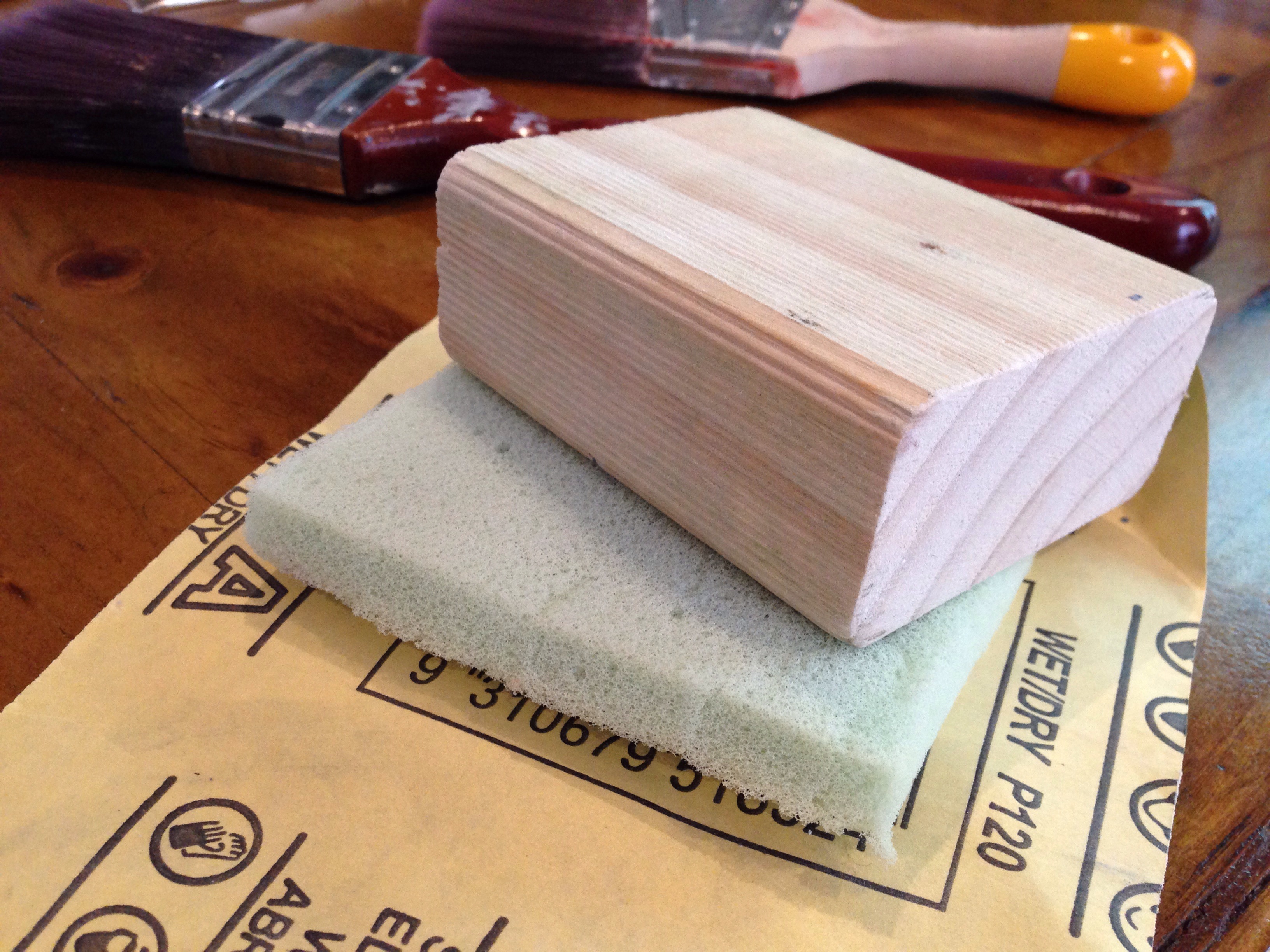 Sanding block with foam and paper.
