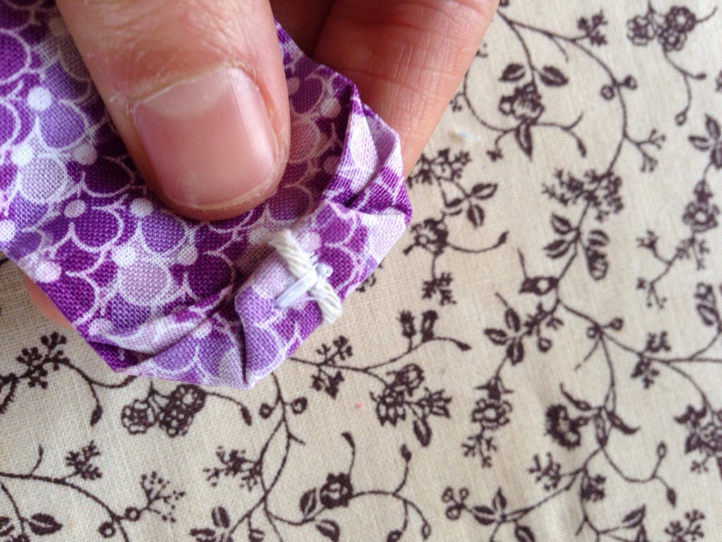 Fold tip again, and sew