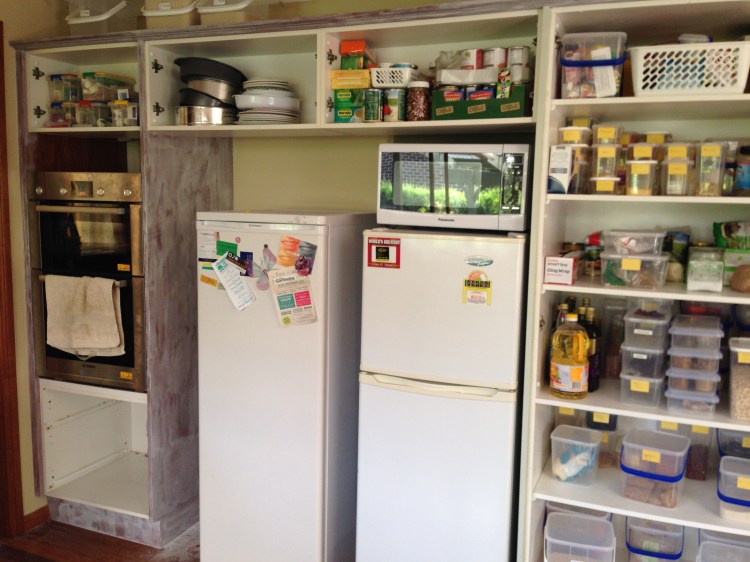 First coat of the primer goes onto the cabinet boxes.