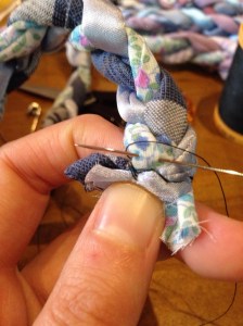 Secure the tops of the legs where the safety pin was.