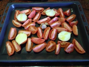 Tomatoes, onion and garlic ready to bake