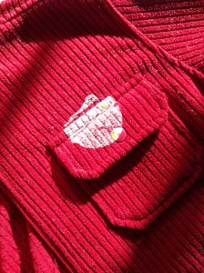 Sticker stain on red jacket