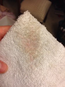 Faint red smudge on the cleaning cloth