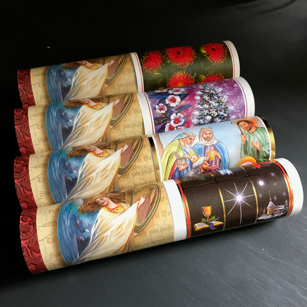 Picture of Christmas cards rolled up like toilet paper tubes.