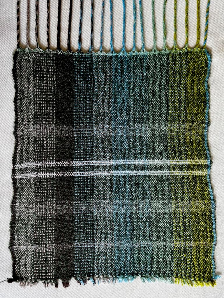 Woollen weaving sample showing vertical stripes
