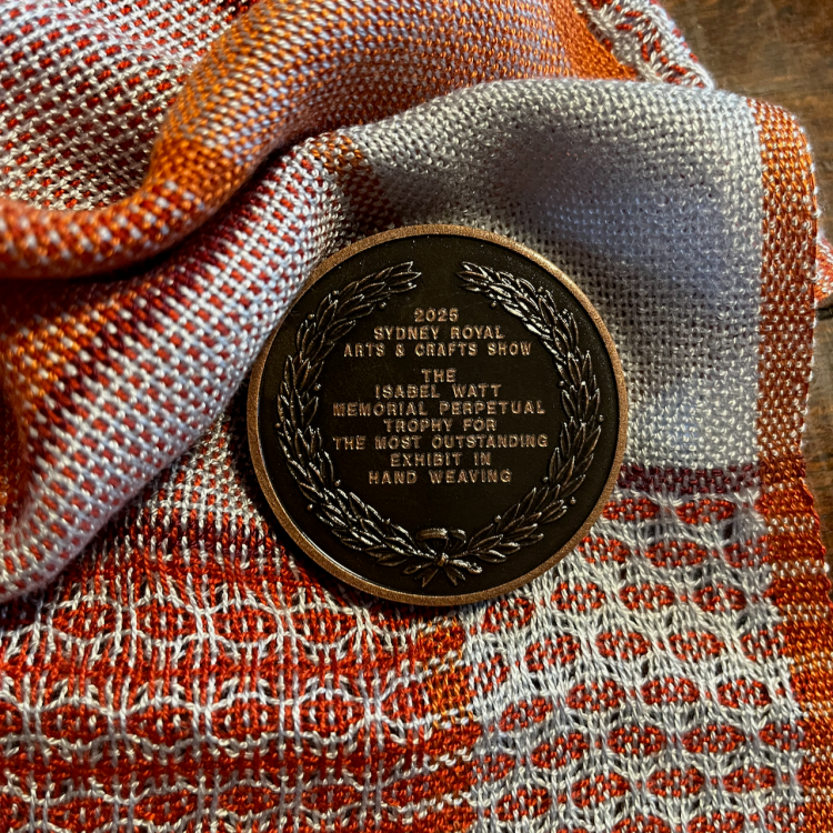A close-up of the medal text (the Isabel Watt perpetual trophy)